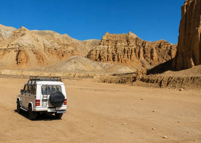 4WD jeep exploring the dramatic desert landscape on the Upper Mustang Overland Tour in Nepal