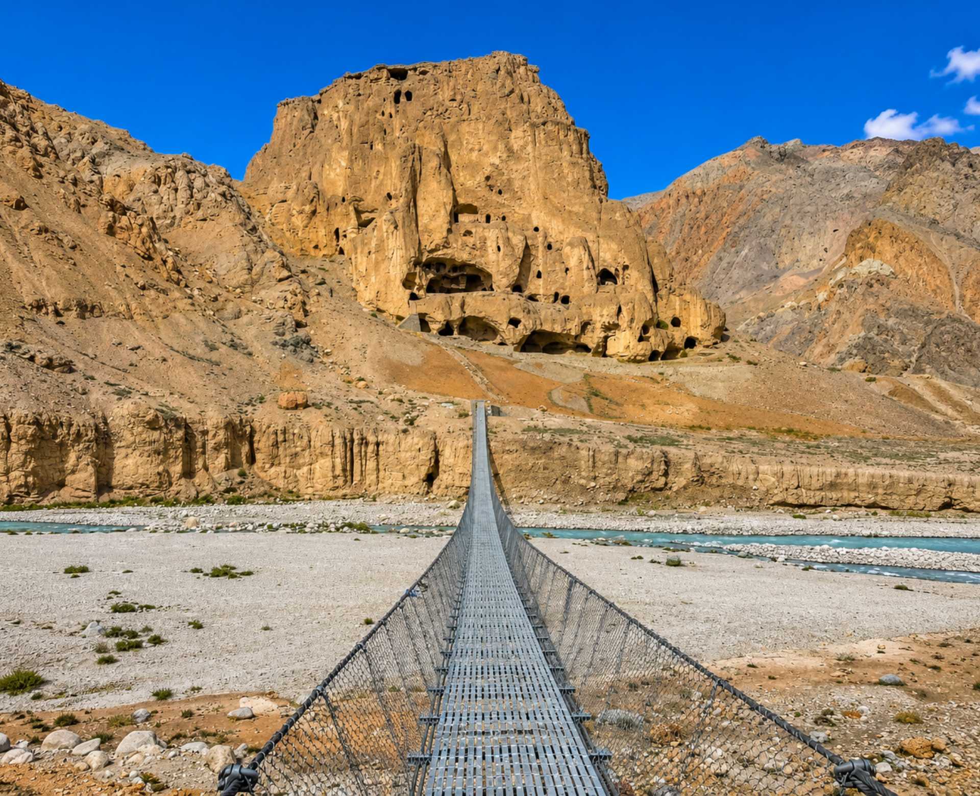 Upper Mustang Tour – Chhoser Sky Caves in Nepal Ancient Chhoser Sky Caves and suspension bridge on the Upper Mustang Tour in Nepal
