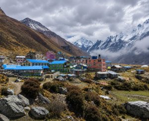 Colorful mountain village surrounded by Himalayan peaks