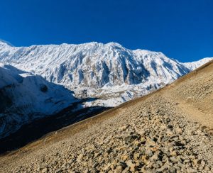 Walking trail to Tilicho Lake through the high mountain landscape