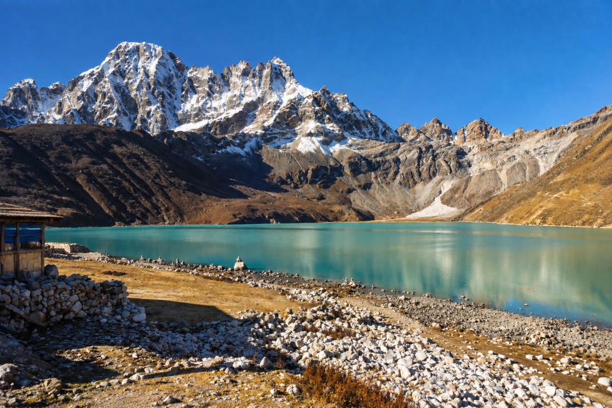 Turquoise glacial waters of Gokyo Cho lake reflecting Mount Cholatse peak along the Everest Gokyo Lakes Trek route in Nepal