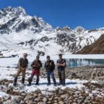 Trekkers walking through the snowy high-altitude landscape of the Everest Gokyo Lakes Trek in Nepal