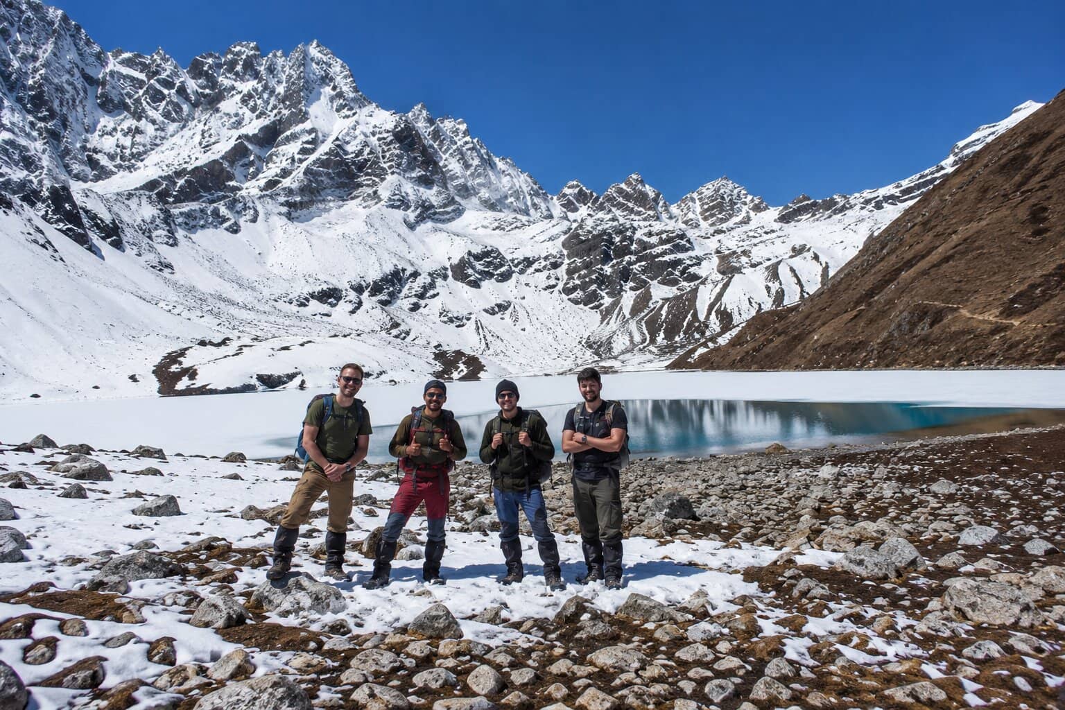 Trekkers walking through the snowy high-altitude landscape of the Everest Gokyo Lakes Trek in Nepal