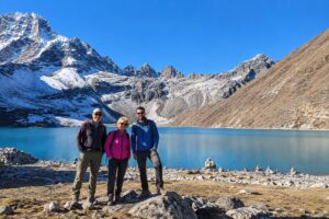 Everest Gokyo Lakes Trek – Hikers at Gokyo Lake, Nepal Hikers beside Gokyo Lake on the Everest Gokyo Lakes Trek in Nepal