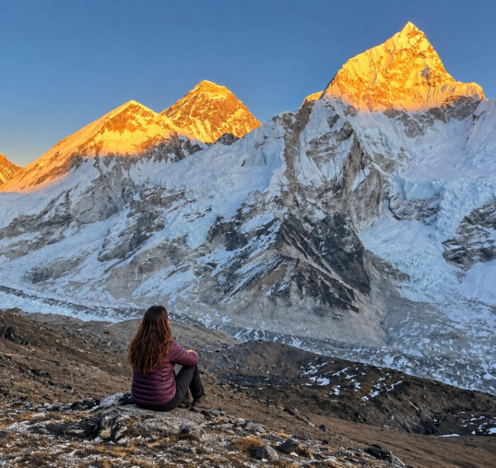 Trekker looking toward Everest from Kala Patthar in Nepal