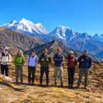 Group of seven hikers on a Himalayan ridge during the Pikey Peak Trek in Nepal