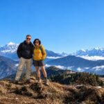 Two trekkers enjoying Himalayan views on the Pikey Peak Trek in Nepal
