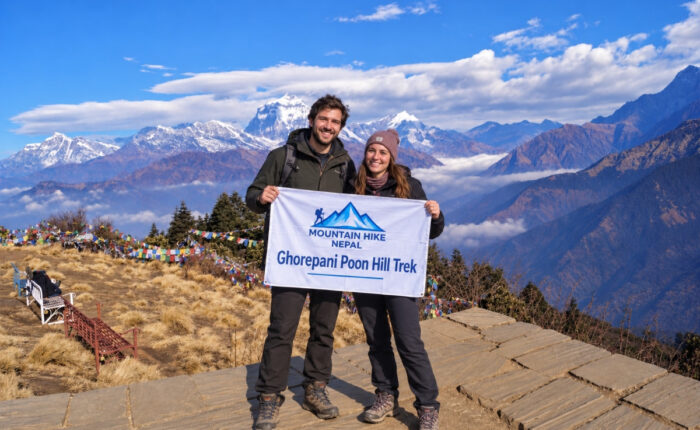 Trekkers at Poon Hill with Annapurna mountain views in Nepal