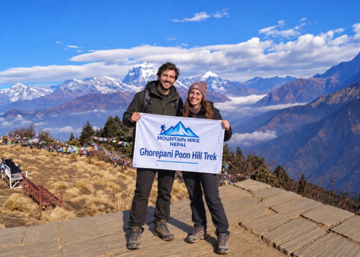 Trekkers at Poon Hill with Annapurna mountain views in Nepal