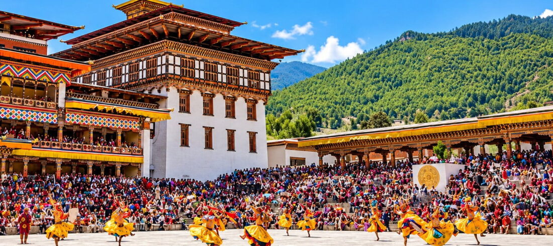 Dancers in traditional yellow silk costumes performing a Cham mask dance at the Thimphu Tshechu festival inside the courtyard of Tashichho Dzong in Bhutan.