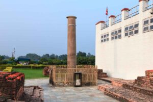 Ashoka Pillar, Lumbini The fenced Ashoka Pillar beside the white Maya Devi Temple in Lumbini