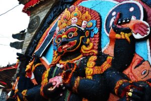 Kal Bhairav, Kathmandu Durbar Square The painted stone Kal Bhairav statue in Kathmandu Durbar Square, with a crown of skulls and flower garlands