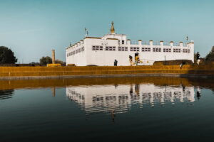 Maya Devi Temple, Lumbini The white Maya Devi Temple in Lumbini reflected in the sacred pond, with the Ashoka Pillar on the left