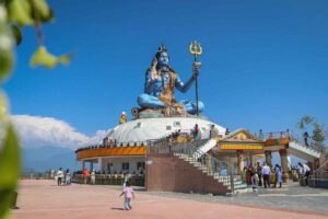 Pumdikot Shiva Statue, Pokhara The large blue Shiva statue at Pumdikot, seated on a white dome above Pokhara